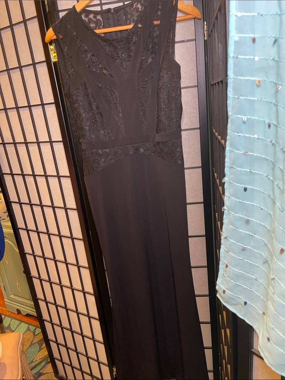 EN FOCUS STUDIO  Delicate black sleeveless lace cocktail dress.
